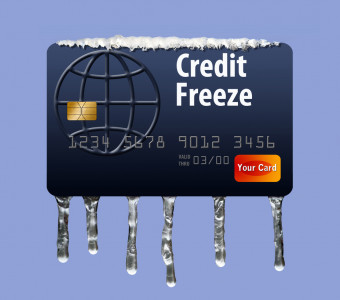 Graphic showing an ice-covered credit card to represent the concept of "credit freeze"