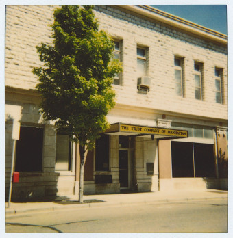 old photo of building with tree