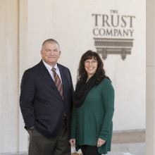 Mark Knackendoffel, CEO and Donna Rose in front of The Trust Company, Manhattan KS